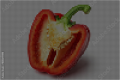 Sliced red bell pepper showing seeds and inner flesh on a grid pattern