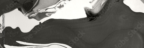 Abstract black and white watercolor painting creating a smooth, flowing marble texture. Artistic background for design or decorative use.