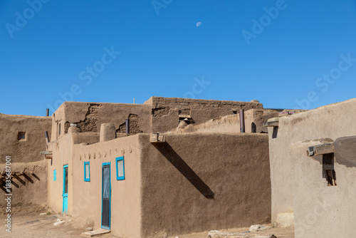 Turquoise Doors and Windows Contrasting with the Rich Brown Mud of the Adobe buildings in Taos Pueblo, Taos, New Mexico
