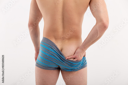 Bild auf Leinwand young sports man posing on an isolated background