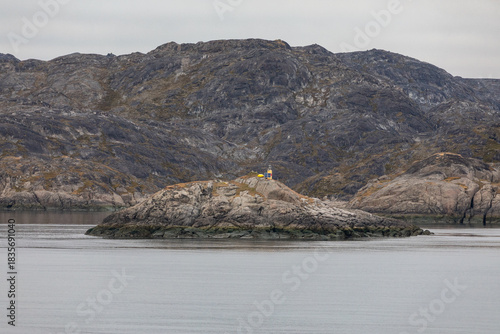 Yellow Lighthouse on an Island Near the Harbor of Nuuk, Greenland on a Cold Autumn Day