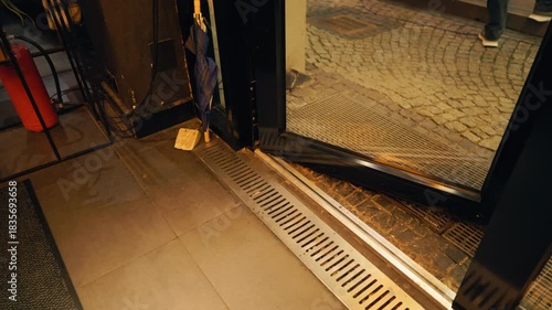 Urban night serenity, Industrial style entrance illuminated softly with urban ambiance captured momentarily