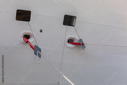 Rat Guards on the Lines and Ropes on the Side of a Cruise Ship at the Pier