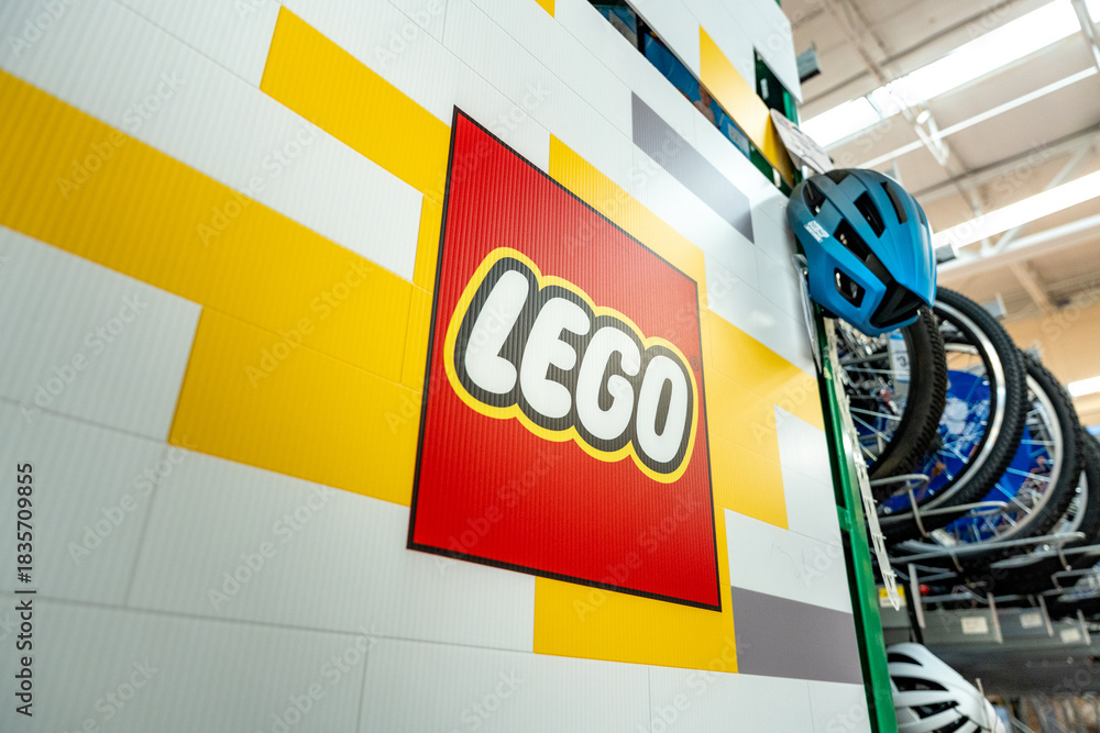 Fototapeta premium Lego logo poster in the supermarket toy section. The Lego Group brand, originated in Denmark. Guadalajara, Jalisco, Mexico, December 4, 2025.