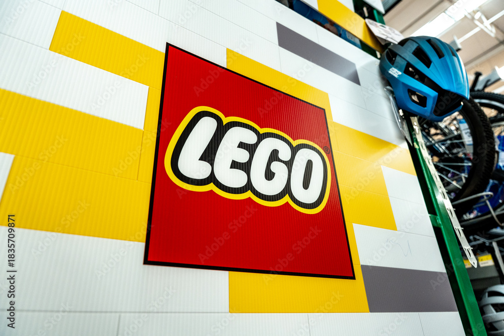 Fototapeta premium Lego logo poster in the supermarket toy section. The Lego Group brand, originated in Denmark. Guadalajara, Jalisco, Mexico, December 4, 2025.