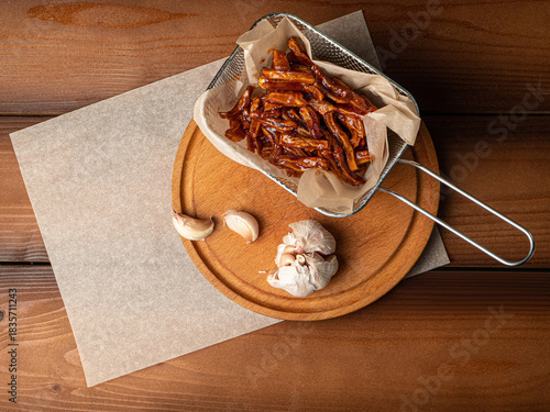 Fotografi marinated fried pig ears, snacks, appetizers, photo for restaurant menu