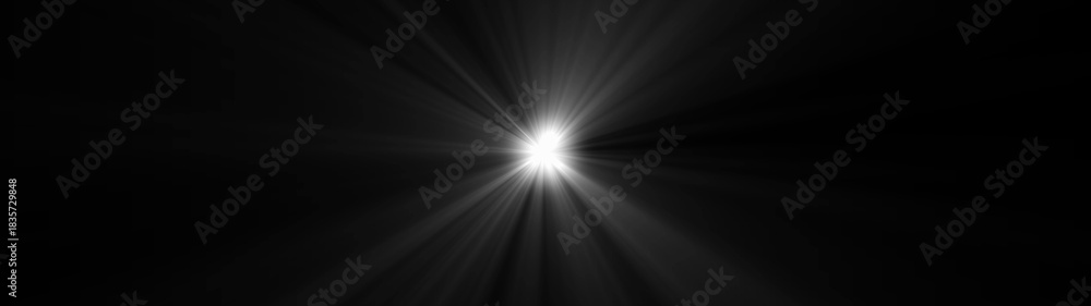 Obraz premium Bright white light source radiating beams of light across a dark black background image