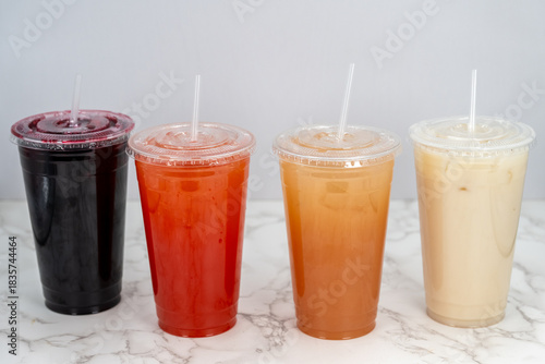 фотографія Tasty choice of sweet drinks of various colors including Jamaica lemonade, guava