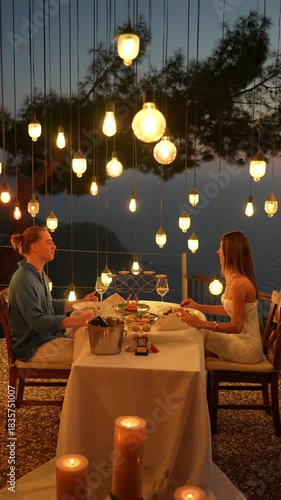 A couple enjoying a romantic dinner together in a warm and intimate atmosphere, capturing love, connection, and elegant holiday dining moments.