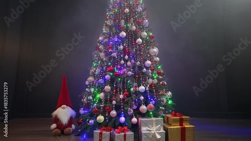 Decorated Norway Spruce With Colorful Lights and Presents Underneath During Holiday Season