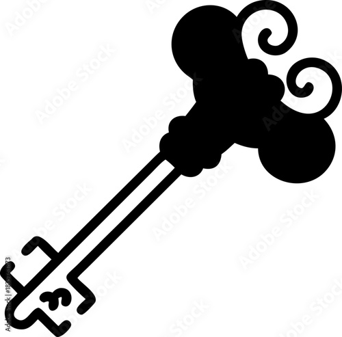 Old Key With Decorative Design Lying on a Flat Surface