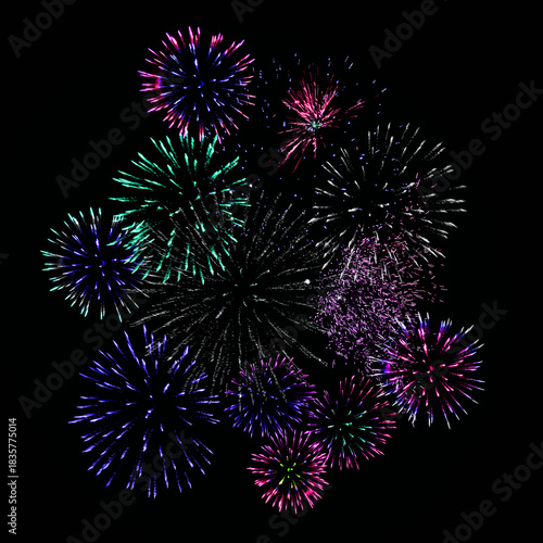Colorful fireworks of various colors over night sky. Celebration and anniversary concept.