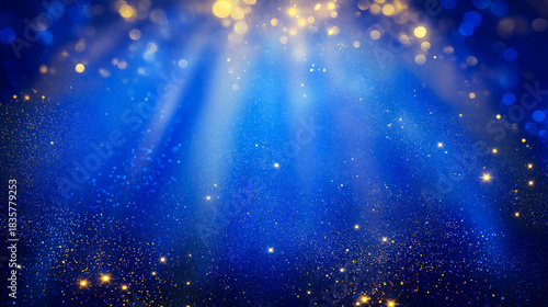 Radiant blue background with golden glitter particles and streaming light rays, creating a magical, festive atmosphere ideal for celebration, inspiration, or luxury-themed commercial use.