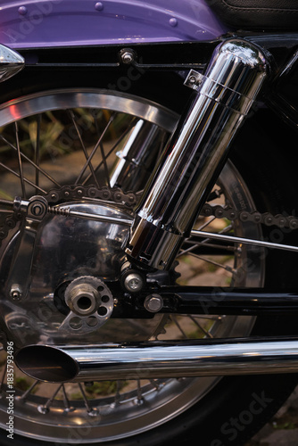 Close-up of the exhaust pipe of a vintage motorcycle.
