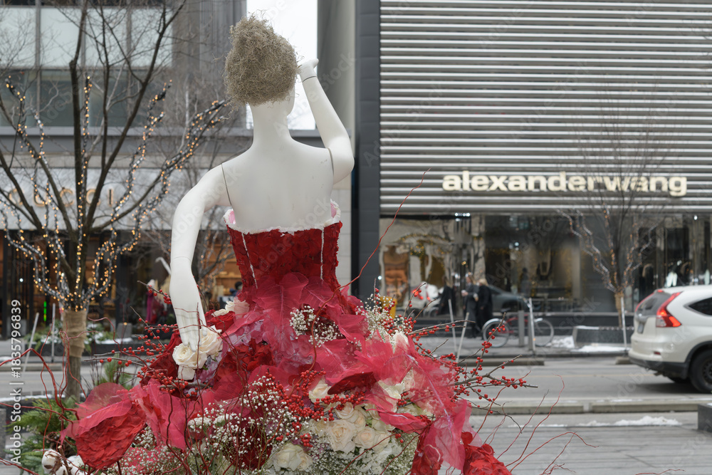 Fototapeta premium mannequin with floral arrangements part of Fleurs de Villes NOËL Bloor-Yorkville, Toronto