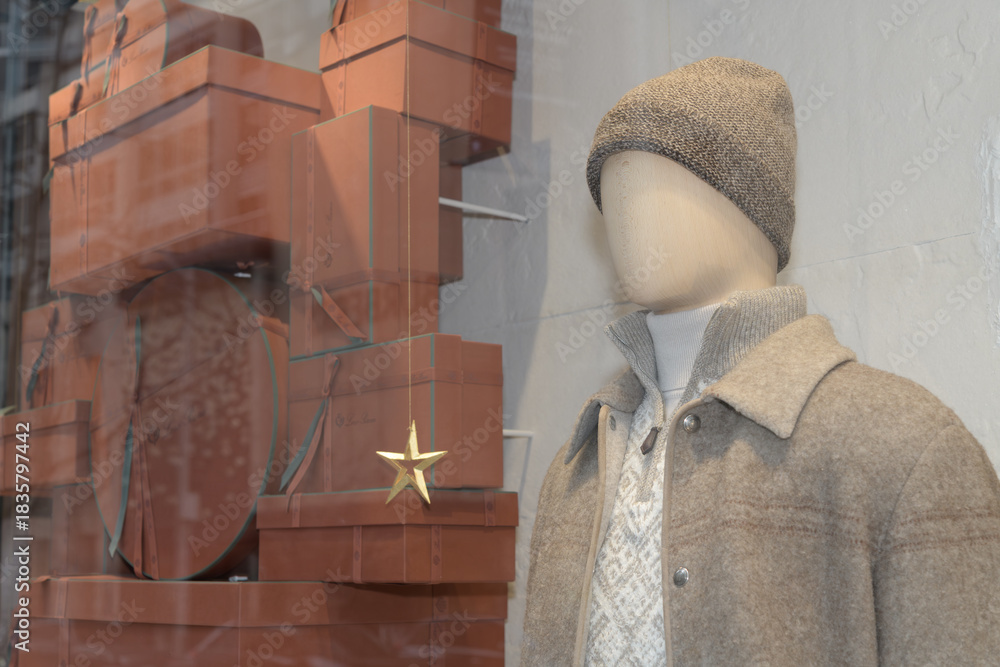 Naklejka premium holiday display window with male mannequin at Loro Piana, a clothing store, located at 111 Bloor St W, Toronto