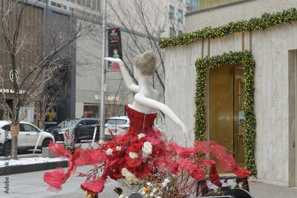 Naklejka premium mannequin with red dress at Fleurs de Villes NOËL Bloor-Yorkville, Toronto