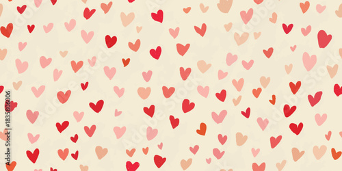 Abstract hearts doodle seamless pattern in pink, red, and warm blush tones for valentine textiles, fabrics, and cheerful packaging.