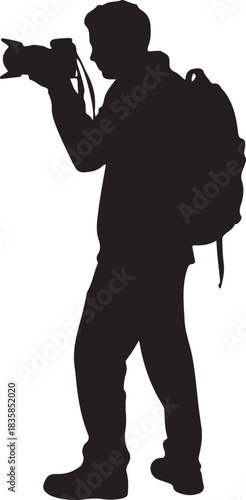 Silhouette of a person with a backpack holding a camera and taking a photo male