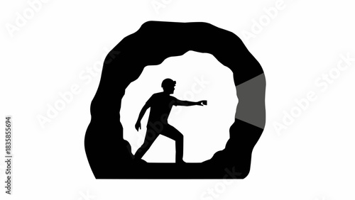 Silhouette of an adventurous man exploring a dark cave.
