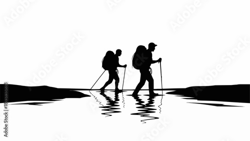 Two hikers walking through water with backpacks and trekking poles.