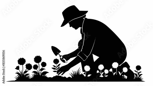 Gardener tending to flowers in silhouette, planting and nurturing blossoms.