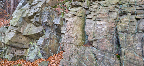Fototapeta Naklejka Na Ścianę i Meble -  Rock formation of the Sudetes mountains in Poland, close-up. Mountain landscapes in autumn with foliage