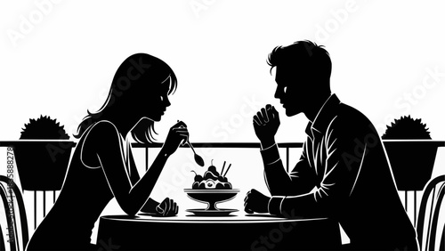 Silhouette of a romantic couple sharing dessert on a date.