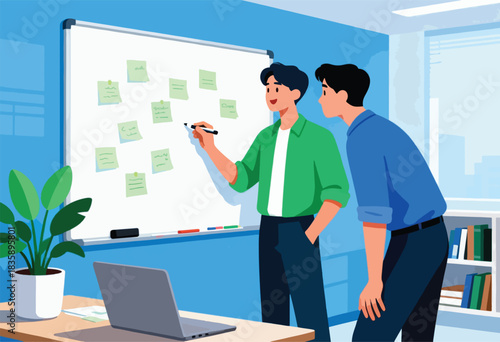 Two men in an office discuss ideas at a whiteboard with sticky notes, laptop on desk, plant and bookshelf visible