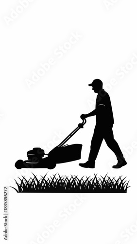 Silhouette of a man mowing the lawn with a lawnmower.