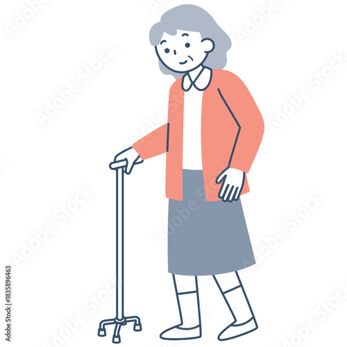 四点杖を使って歩くシニア女性