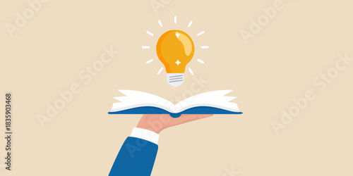 Knowledge and ideas hand holding book with glowing light bulb above