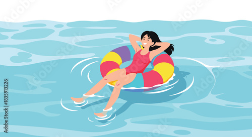 A woman enjoying a summer day floating on a colorful inflatable ring in the clear blue ocean water.