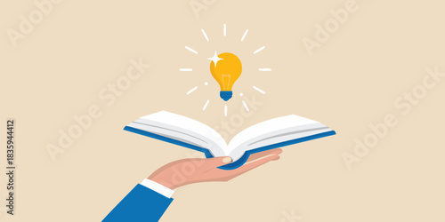 Hand holding open book with lightbulb shining idea generation concept