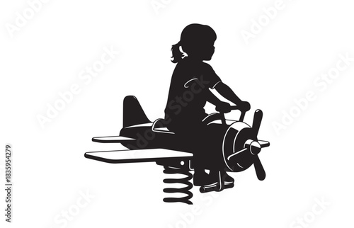 Silhouette of a young child s joyful imagination taking flight on a spring loaded airplane playground ride
