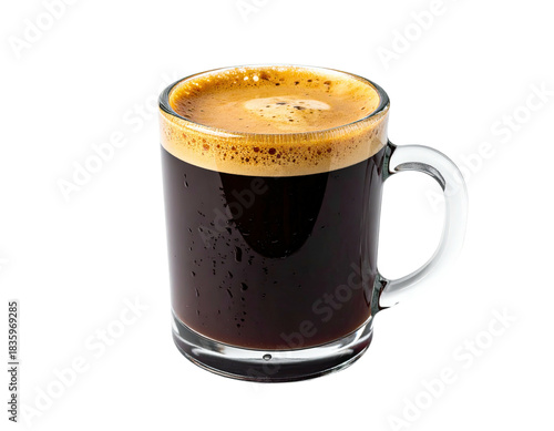 Close-up of coffee drink in clear glass mug with crema, isolated on black background