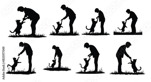 Black silhouettes of people and cats playing on grass