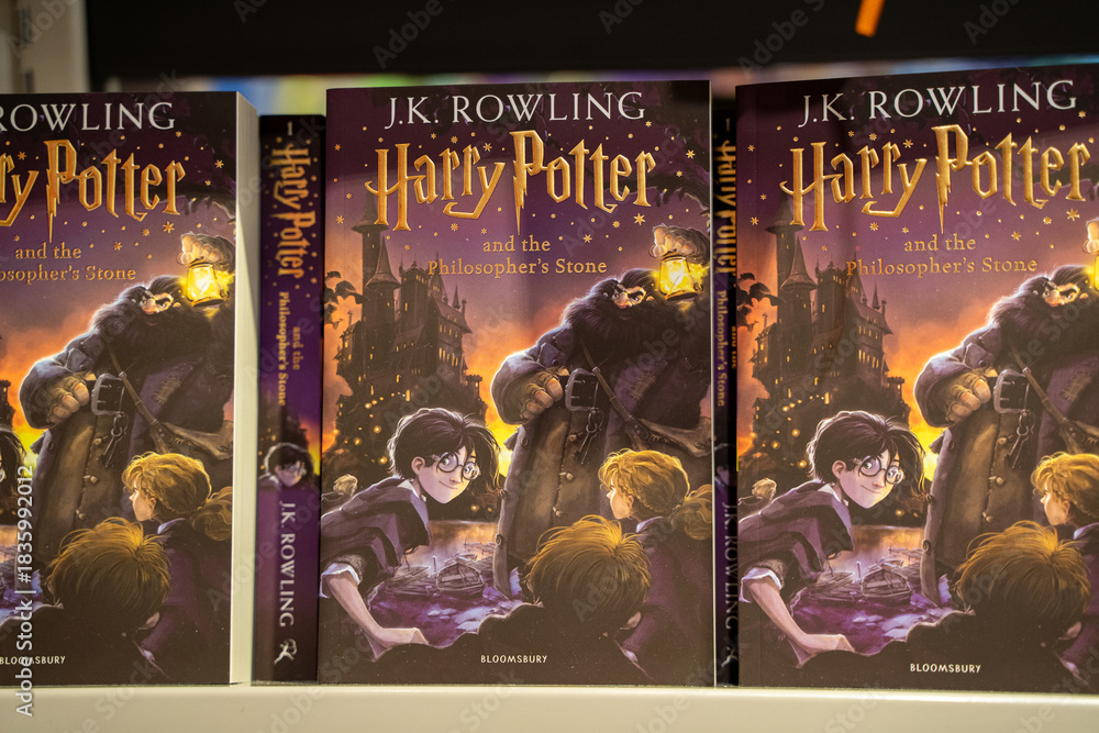 Naklejka premium Close up of Harry Potter and the Philosopher's Stone book covers. Toronto, Canada - December 3, 2025.