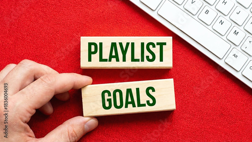 Playlist Goals Inspiration Music Motivation for Achieving Dreams Wooden Blocks Keyboard Red Background Hand Inspiration