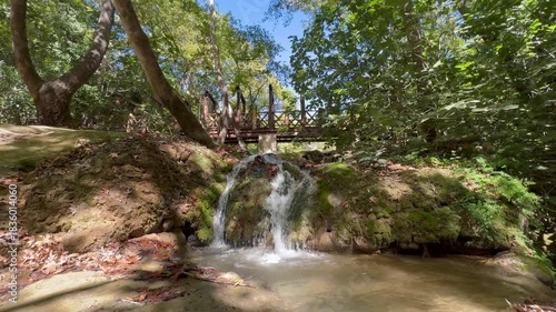 Waterfall wooden bridge. High quality photo