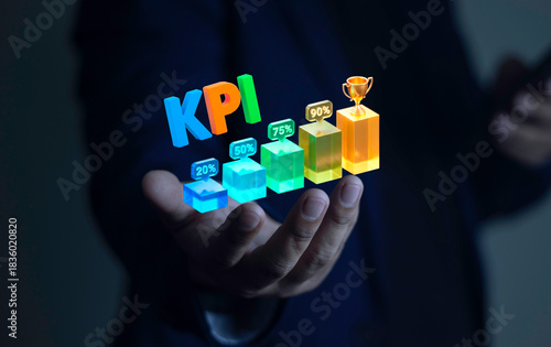Businessman holding 3D model KPI, growth graph and trophy. Concept of business success indicators, growth, development, success steps, and performance report.