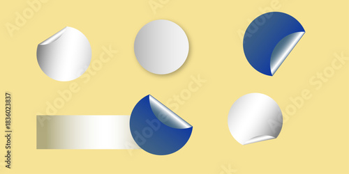 Circle adhesive stickers. White tags, paper round stickers with peeling corner isolated on Light yellow / beige background. Blank blue round stickers with curled corners, realistic mockup .