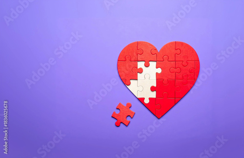 Heart puzzle missing piece on purple background