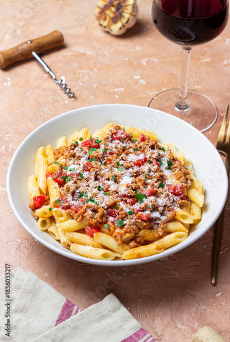 Pasta with bolognese sauce and cheese. Italian cuisine. Traditional recipe.