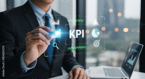 Businessman analyzing key performance indicators with digital interface for business growth