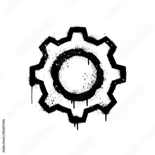 Black graffiti spray-painted gear icon, machinery mechanism symbol, dripping.