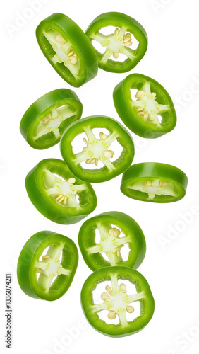 Sliced green jalapeño peppers falling against a black backdrop showcasing their vibrant color and texture perfect for culinary themes and food photography projects on transparent background