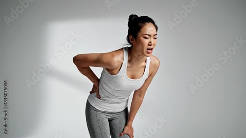 Woman Experiencing Pain Concept on White, Illustrating Physical Discomfort With Expressions