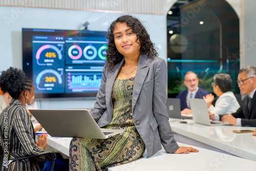 Scene confident of businesswoman post with business team meeting in meeting room.