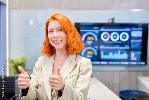 Smile businesswoman trumbing up for portrait in confirm quality product business in meeting room background.